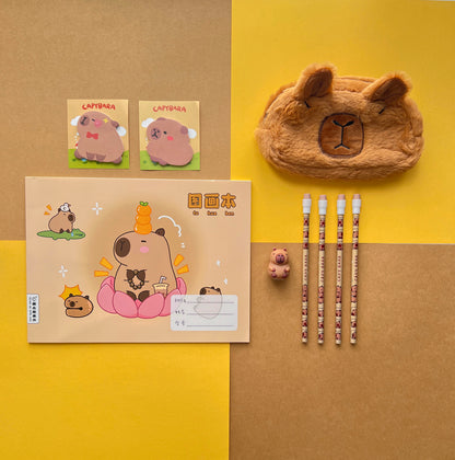 Capybara stationery bundle featuring a plush pencil case, A4 notebook, sticky notes, and pencils.