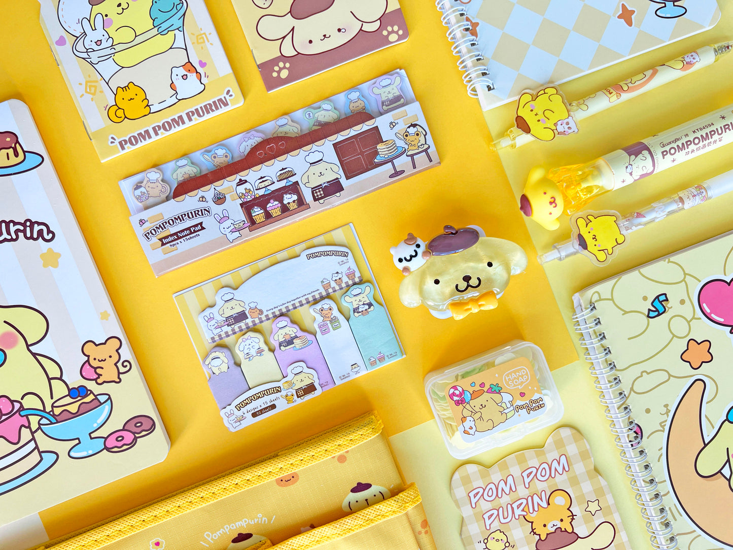 Yellow cartoon character desk accessories and school stationery supplies including highlighter pens and sticky notes.