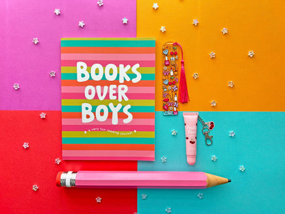 Reading journal gift set featuring a Books Over Boys journal, pink jumbo pencil, acrylic bookmark, and lip balm.
